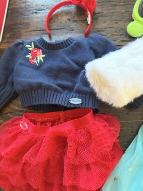 Navy Knit Cropped Sweater with Red Floral whit fur coat, teal skirt brush